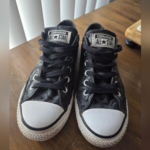 Converse All Star sneakers featuring a black rose print pattern
